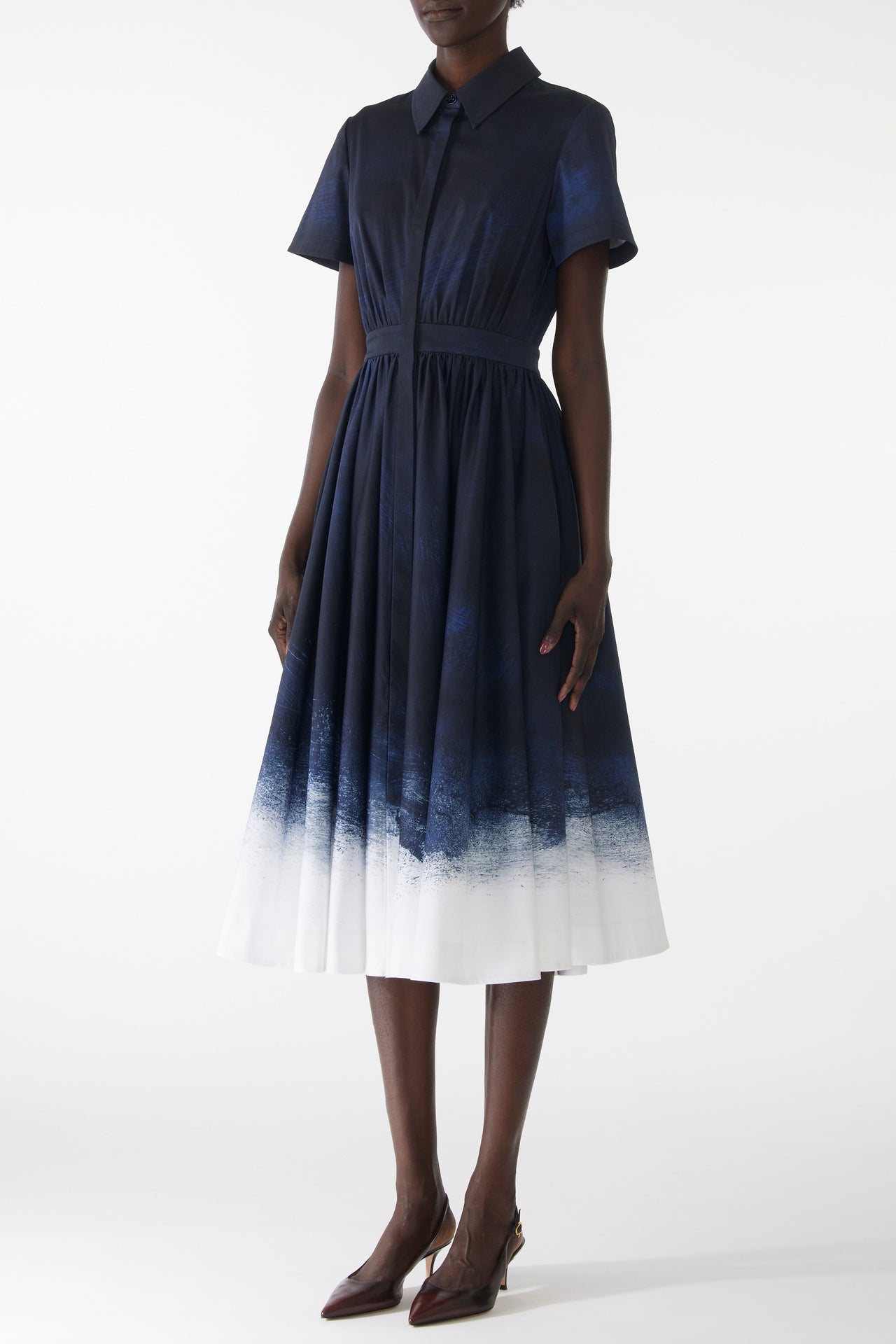 Model wearing a stretch cotton shirtdress with navy-and-white smudged print, featuring a tailored fit, button front, and soft brushed texture view 2
