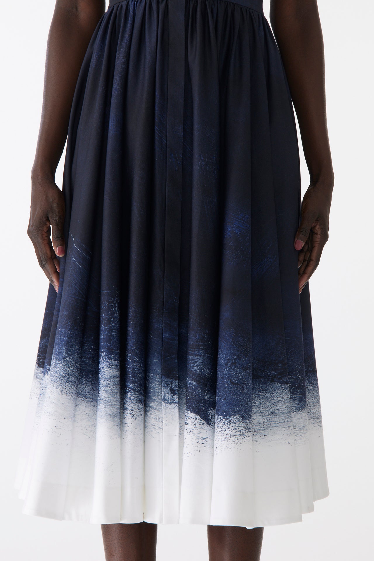 Model wearing a stretch cotton shirtdress with navy-and-white smudged print, featuring a tailored fit, button front, and soft brushed texture view 4
