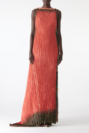 Model wearing pleated painted stripe gown with boat neckline and scooped back view 1