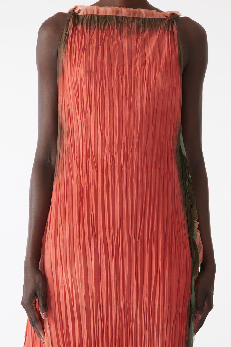 Model wearing pleated painted stripe gown with boat neckline and scooped back view 4