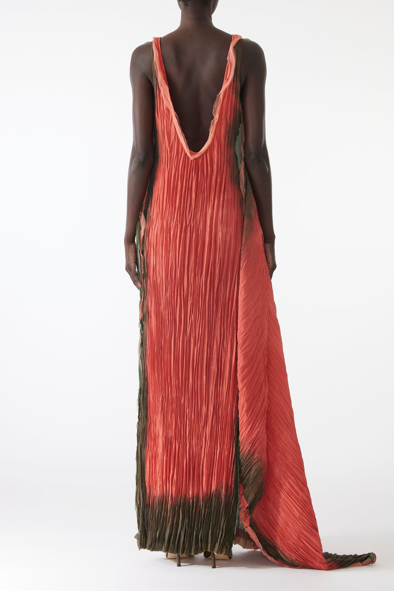 Model wearing pleated painted stripe gown with boat neckline and scooped back view 3