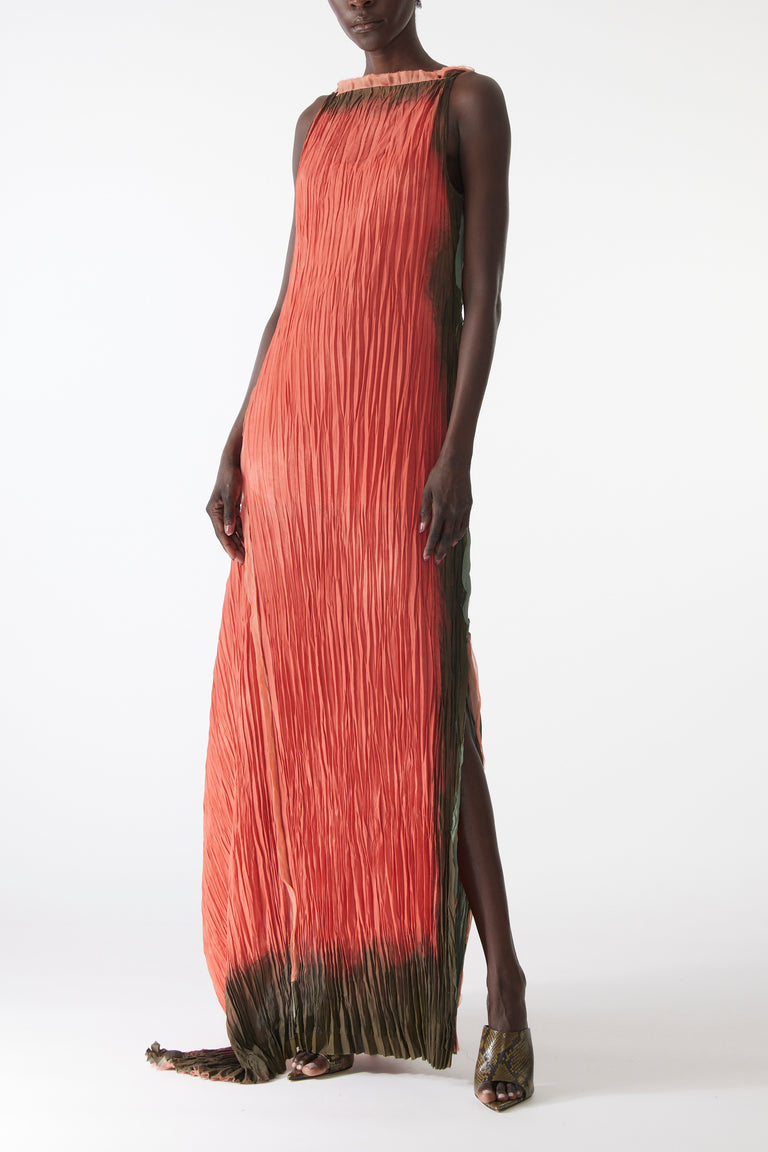 Model wearing pleated painted stripe gown with boat neckline and scooped back view 2