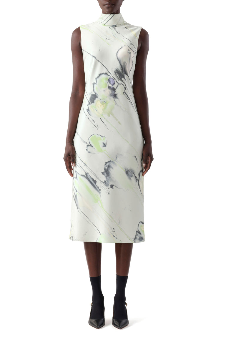 Model in a jade multi watercolor floral midi dress with scarf detail and bias-cut drape. view 2