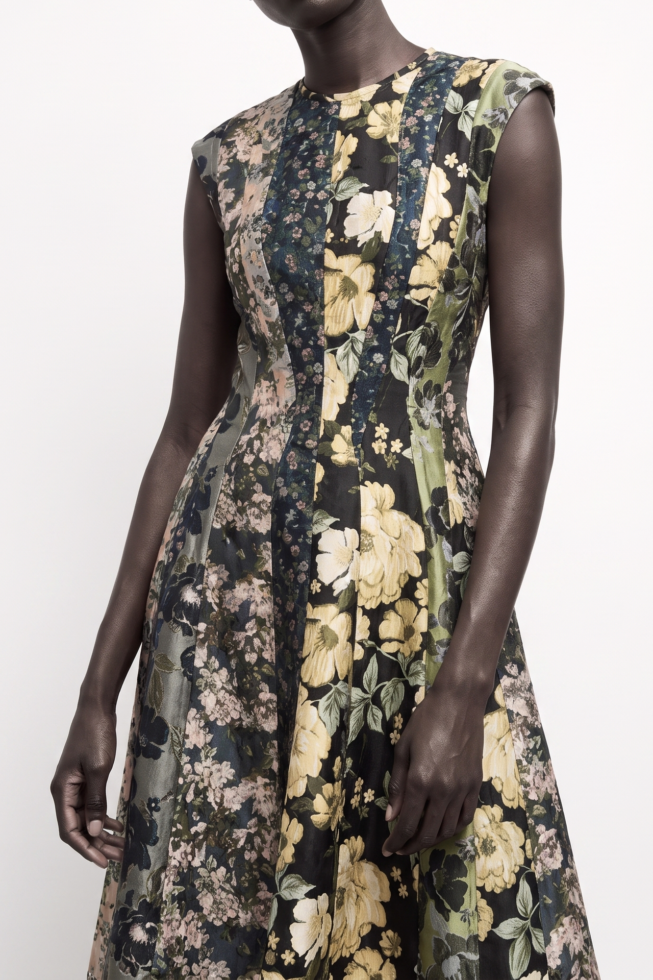 A sleeveless fit-and-flare dress with a floral print, shown on a model and a plain light background. view 2