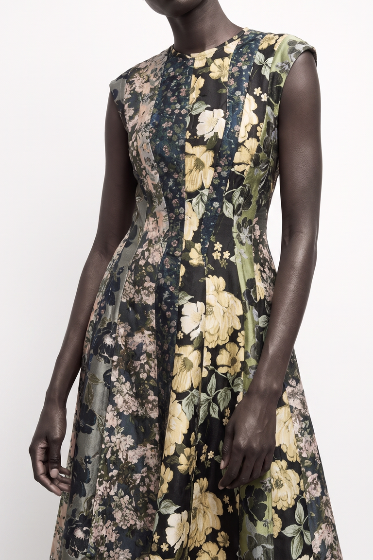 A sleeveless fit-and-flare dress with a floral print, shown on a model and a plain light background. view 2