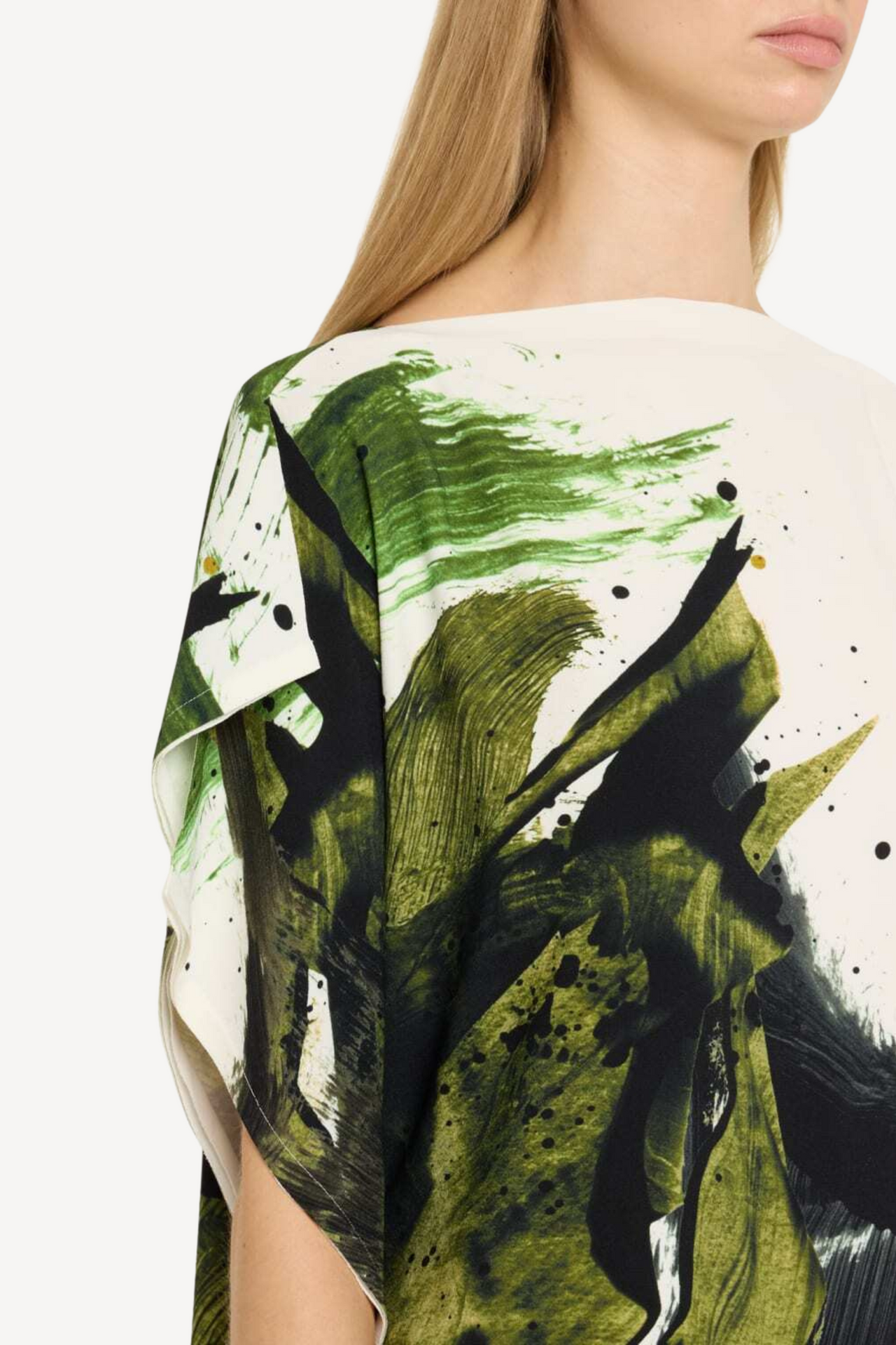 Model wearing an asymmetrical brushstroke printed crepe boatneck top with artistic flair. view 3