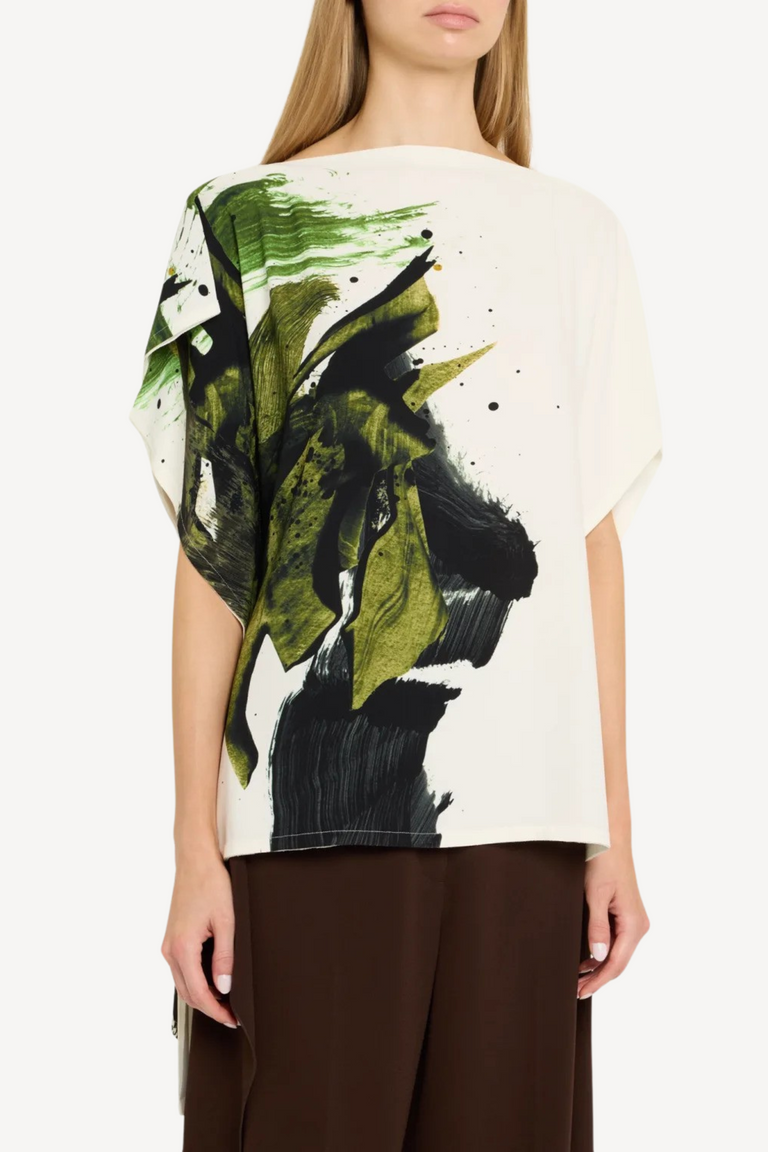 Model wearing an asymmetrical brushstroke printed crepe boatneck top with artistic flair. view 4