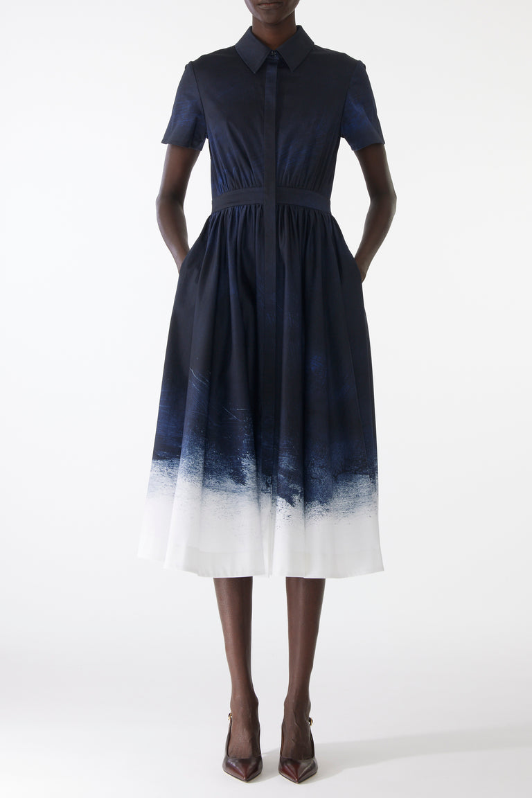 Model wearing a stretch cotton shirtdress with navy-and-white smudged print, featuring a tailored fit, button front, and soft brushed texture view 1