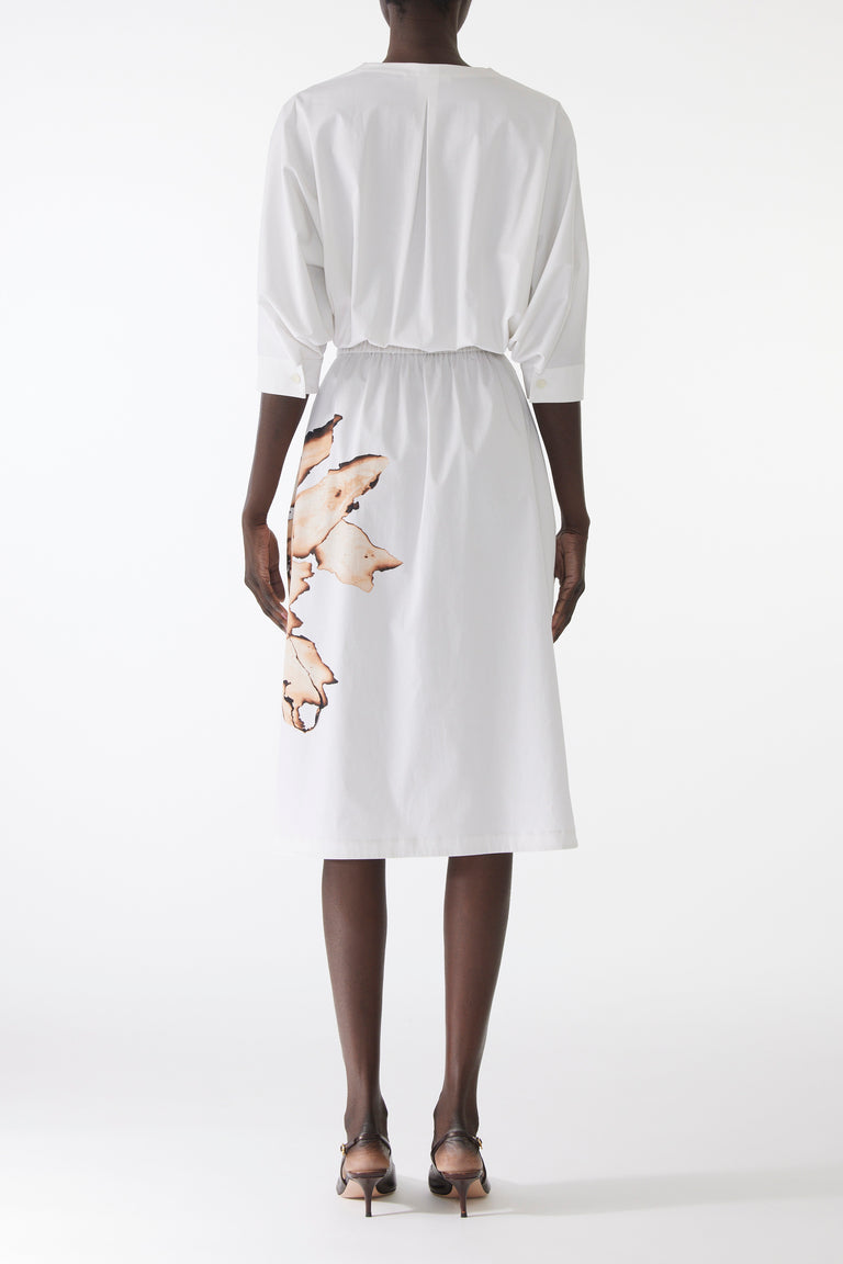 Model wearing cotton dress with dolman sleeves and an allover floral print, featuring a relaxed fit and softly structured silhouette. view 2