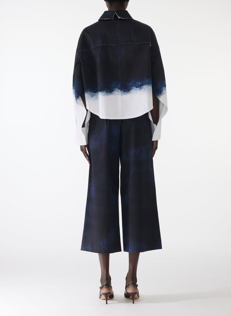 Model wearing navy and white dip-dyed pop-over shirt in stretch cotton with a relaxed fit and painterly smudged effect. view 3